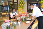 Chef Alex Destriza prepares the table with his team